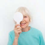 Woman with paddle during eye exam