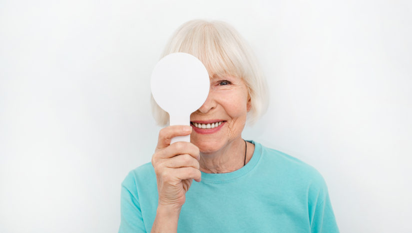 Woman with paddle during eye exam