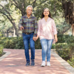 Happy senior couple spending leisure time in park.