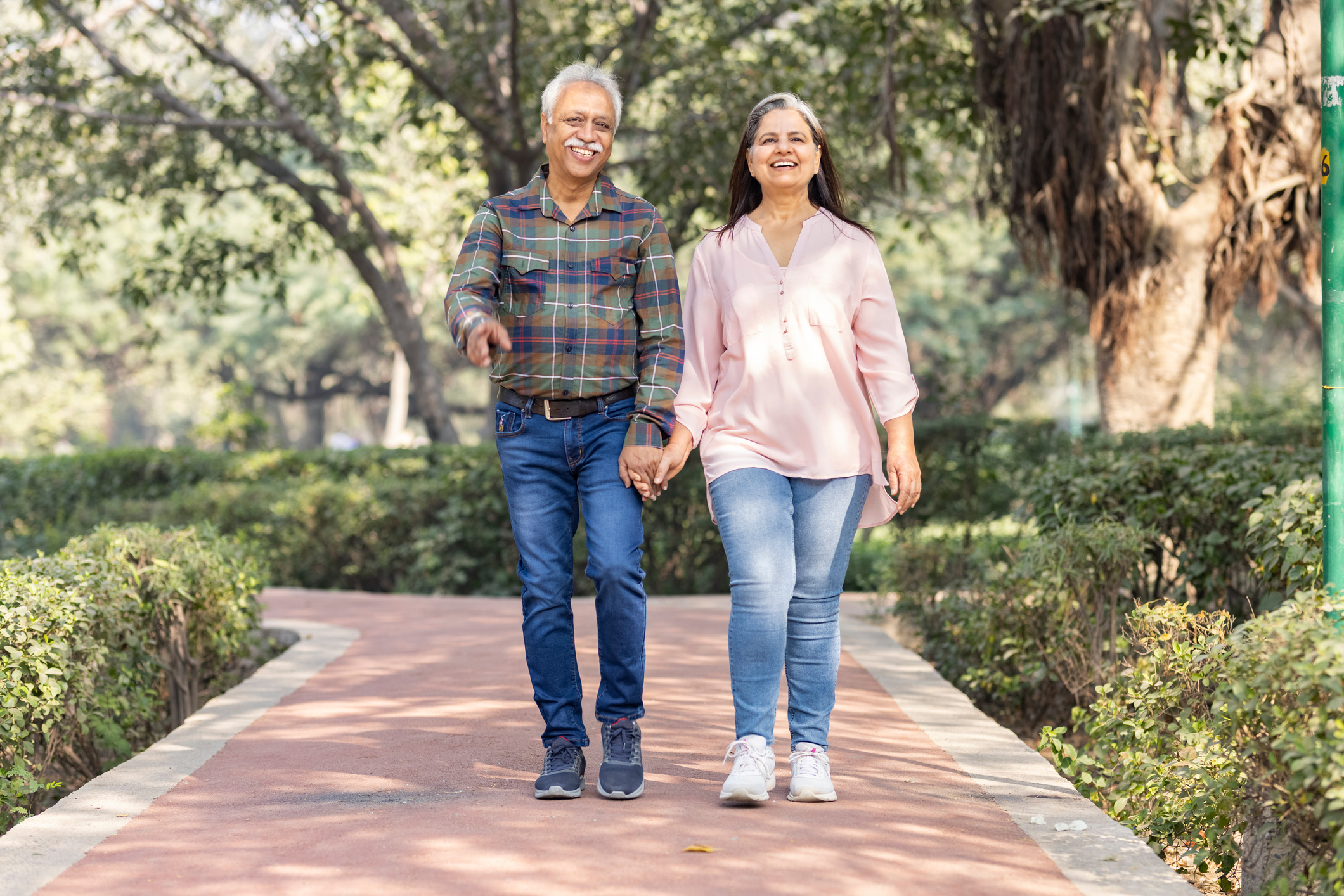 Happy senior couple spending leisure time in park.
