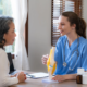 Female doctor is introducing an elderly Asian female patient about bone diseases and treatment method and medicine details.